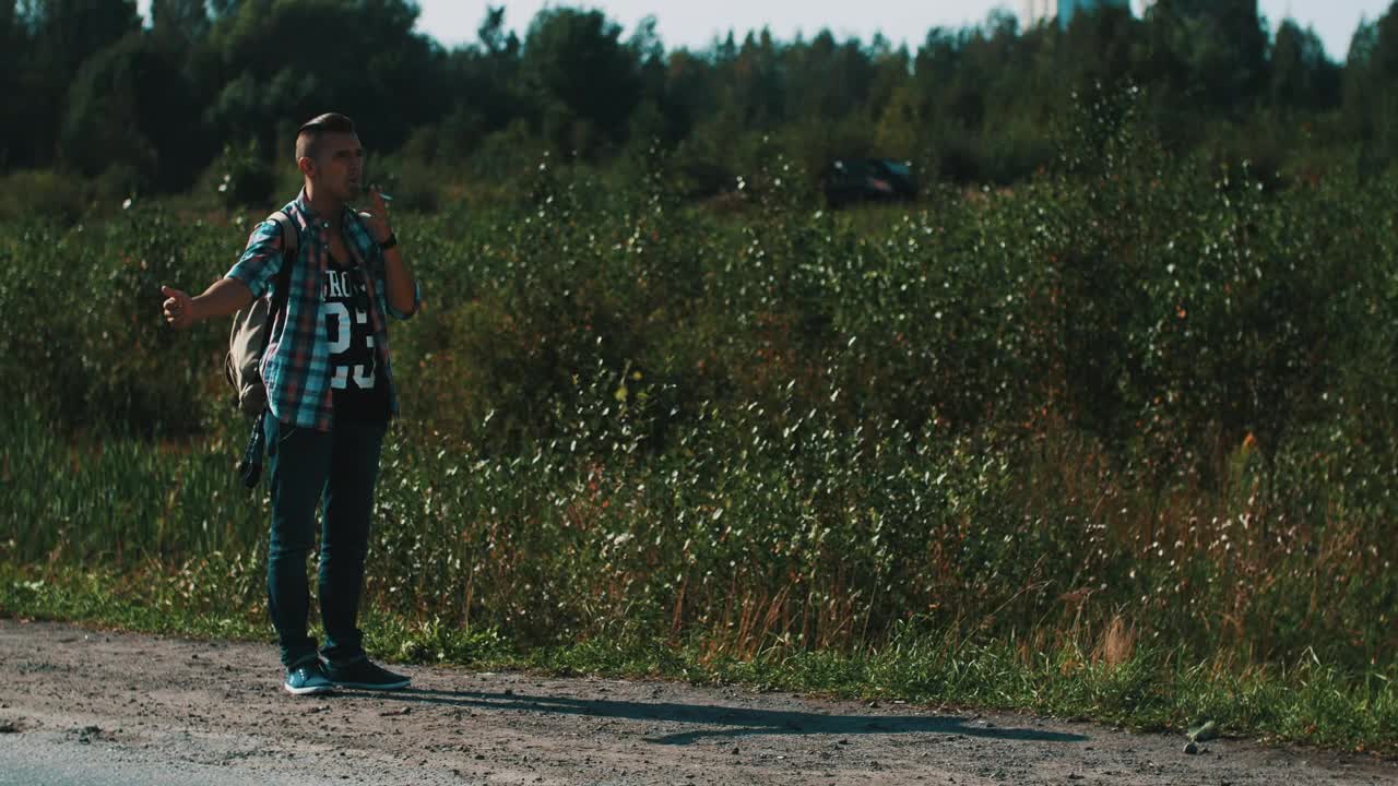 Free Video Stock Smoking Man Hitchhiking In A Rural Area Live Wallpaper - Free Download