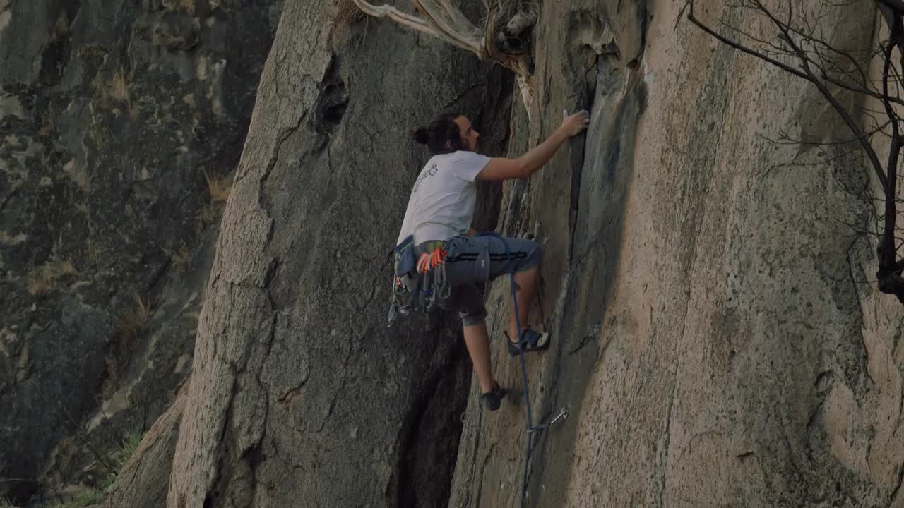 Stock Video Experienced Mountaineer Climbing A Rocky Mountain Live Wallpaper For PC - Free Download