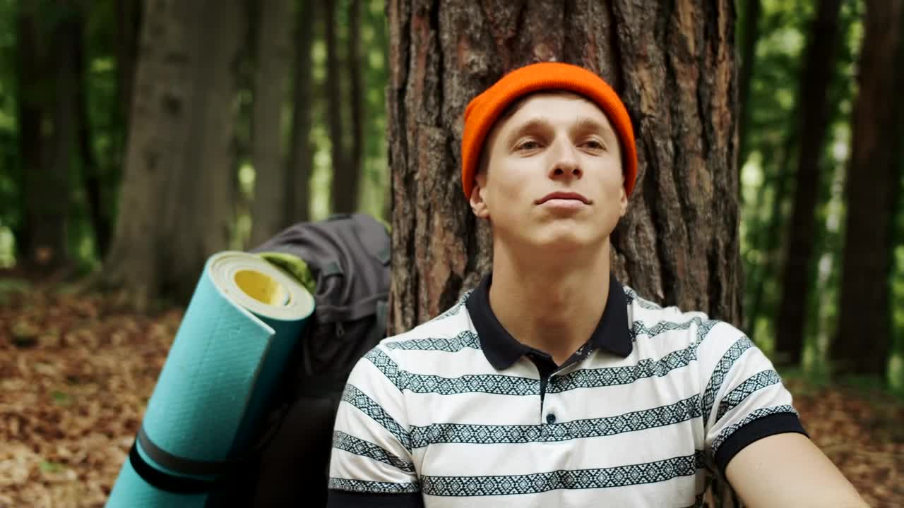 Stock Video Man Resting In A Forest With Hopeful Attitud Animated Wallpaper - Free Download