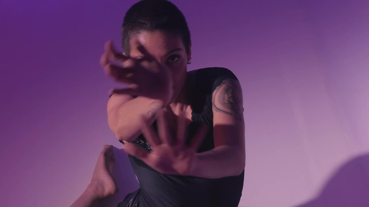 Free Stock Video Young Woman Dancing Sitting On The Floor On Lilac Background Live Wallpaper - Free Download