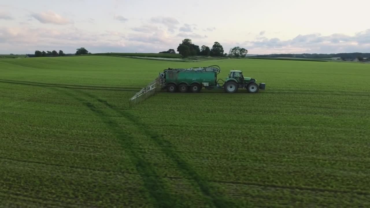 Free Video Stock tractor working on an agriculture field Live Wallpaper - Free Download