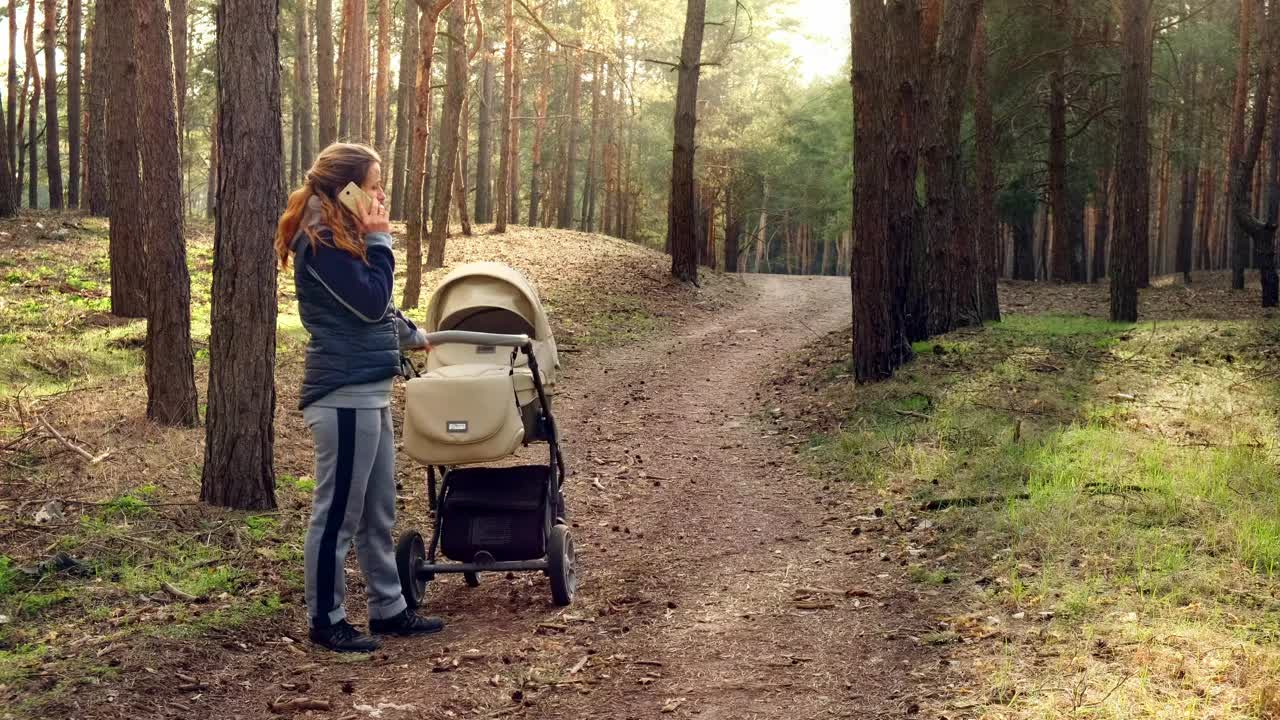 Stock Video Mom Talking On The Phone In The Wood Animated Wallpaper - Free Download
