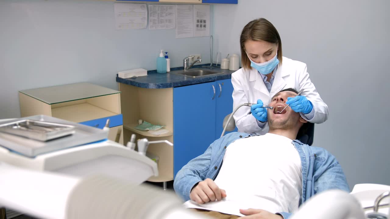 Stock Video Dentist Treating Teeth At Her Clinic Live Wallpaper For PC - Free Download
