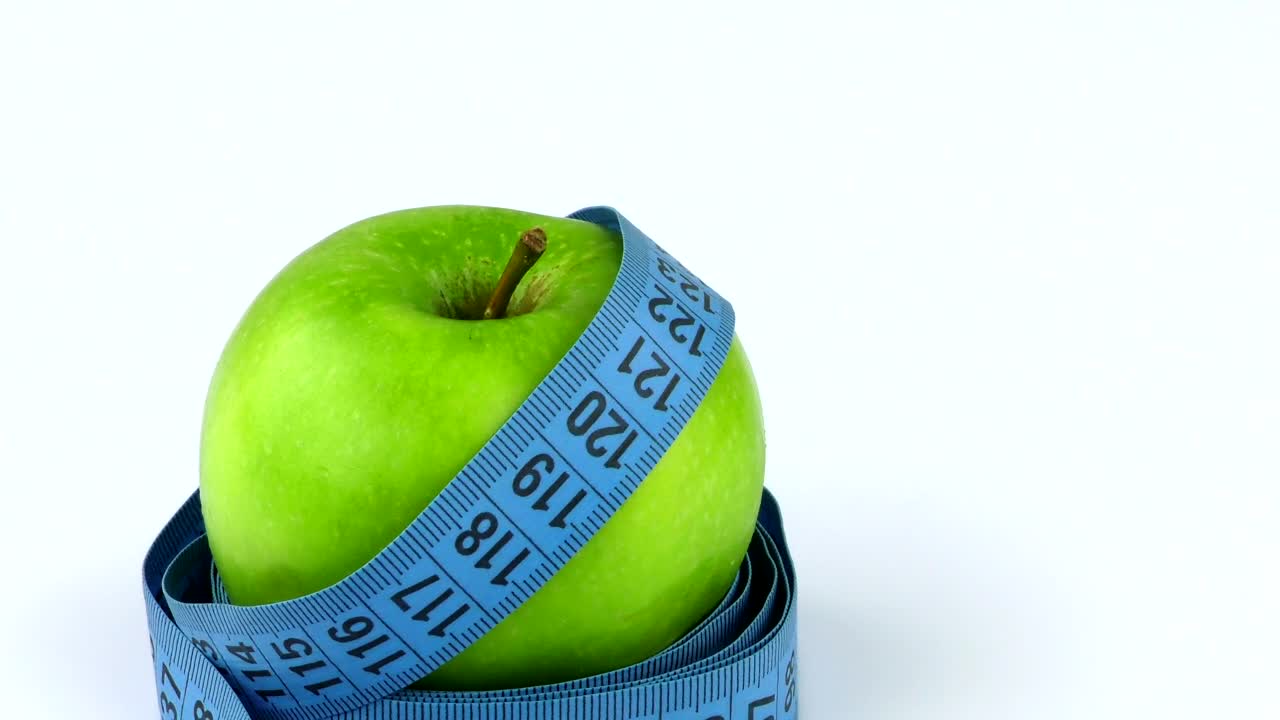 Stock Video Measuring Tape Around An Appl Animated Wallpaper - Free Download