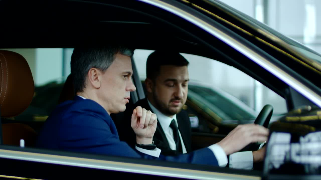 Free Stock Video Salesman Showing The Car To A Client Live Wallpaper - Free Download