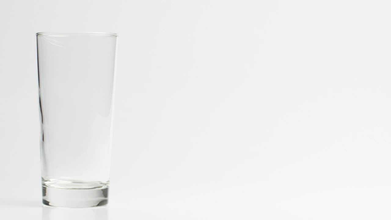Stock Video Dropping Ice Into A Glass Live Wallpaper For PC - Free Download