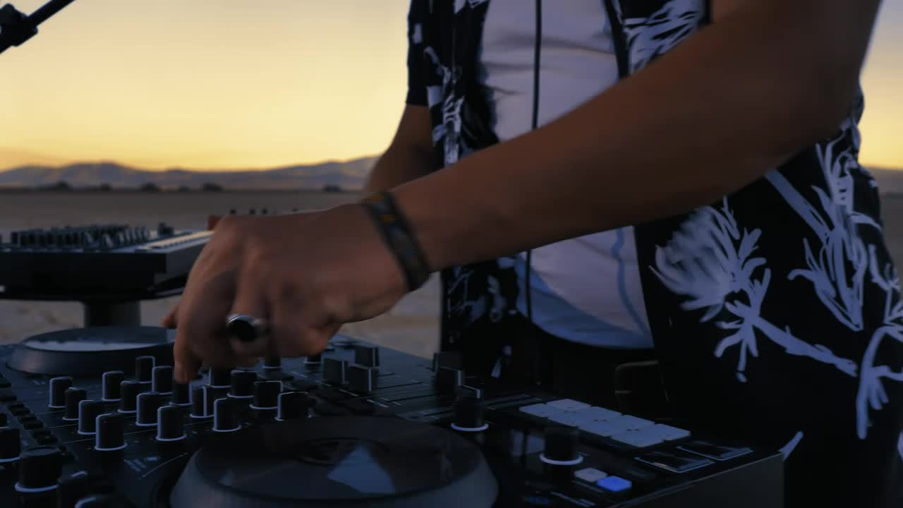 Stock Video Dj Mixing With His Equipment In A Desert Live Wallpaper For PC - Free Download