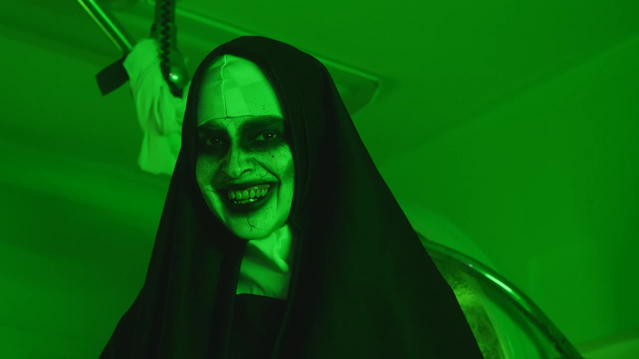Free Video Stock terrifying woman disguised as a nun under a green light Live Wallpaper - Free Download