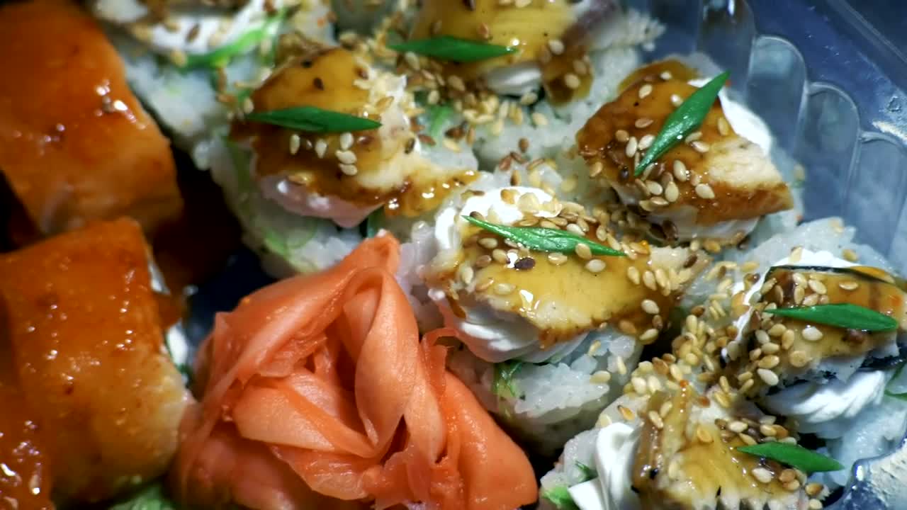 Free Video Stock sushi and chopsticks in plastic container Live Wallpaper - Free Download
