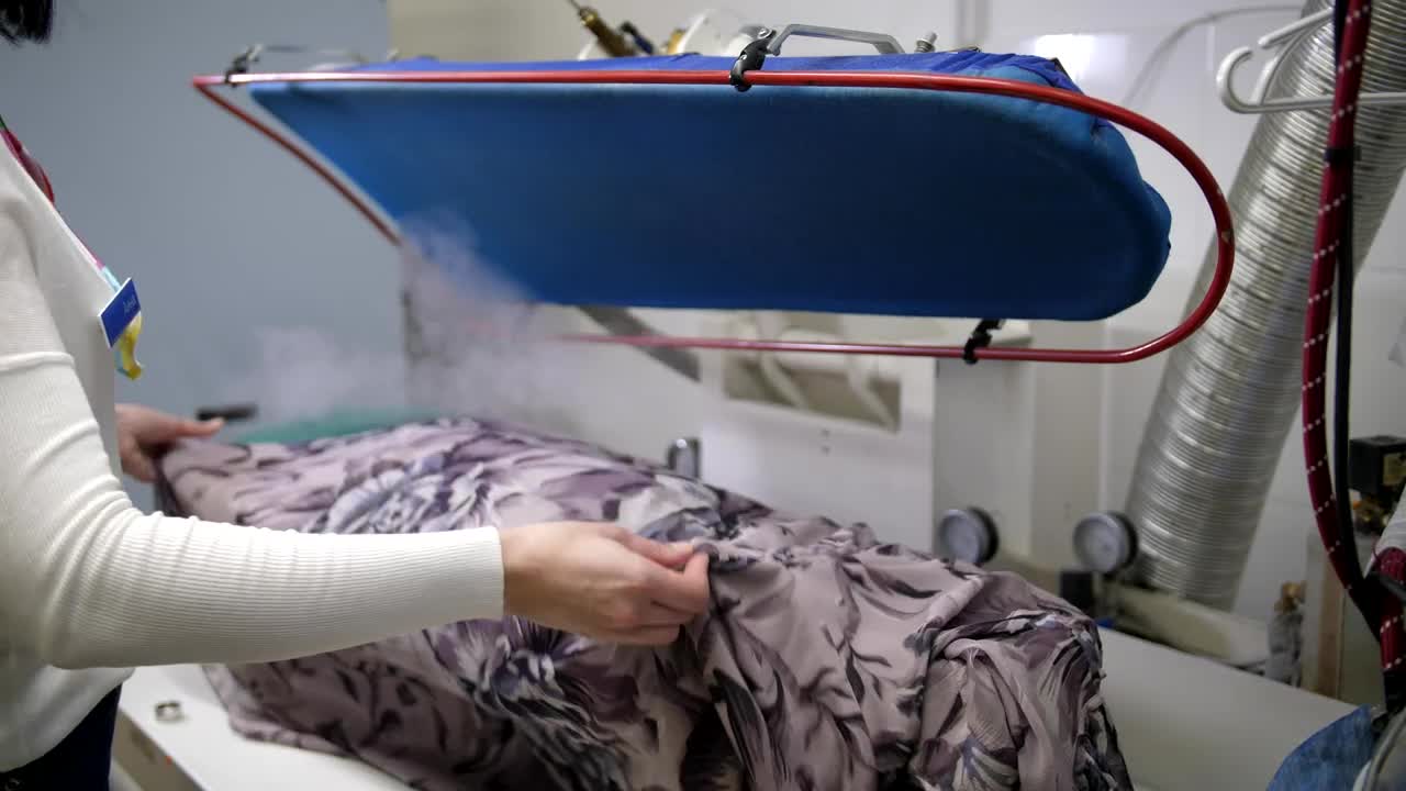 Stock Footage Using A Steam Cleaner On A Dress Live Wallpaper - Free Download