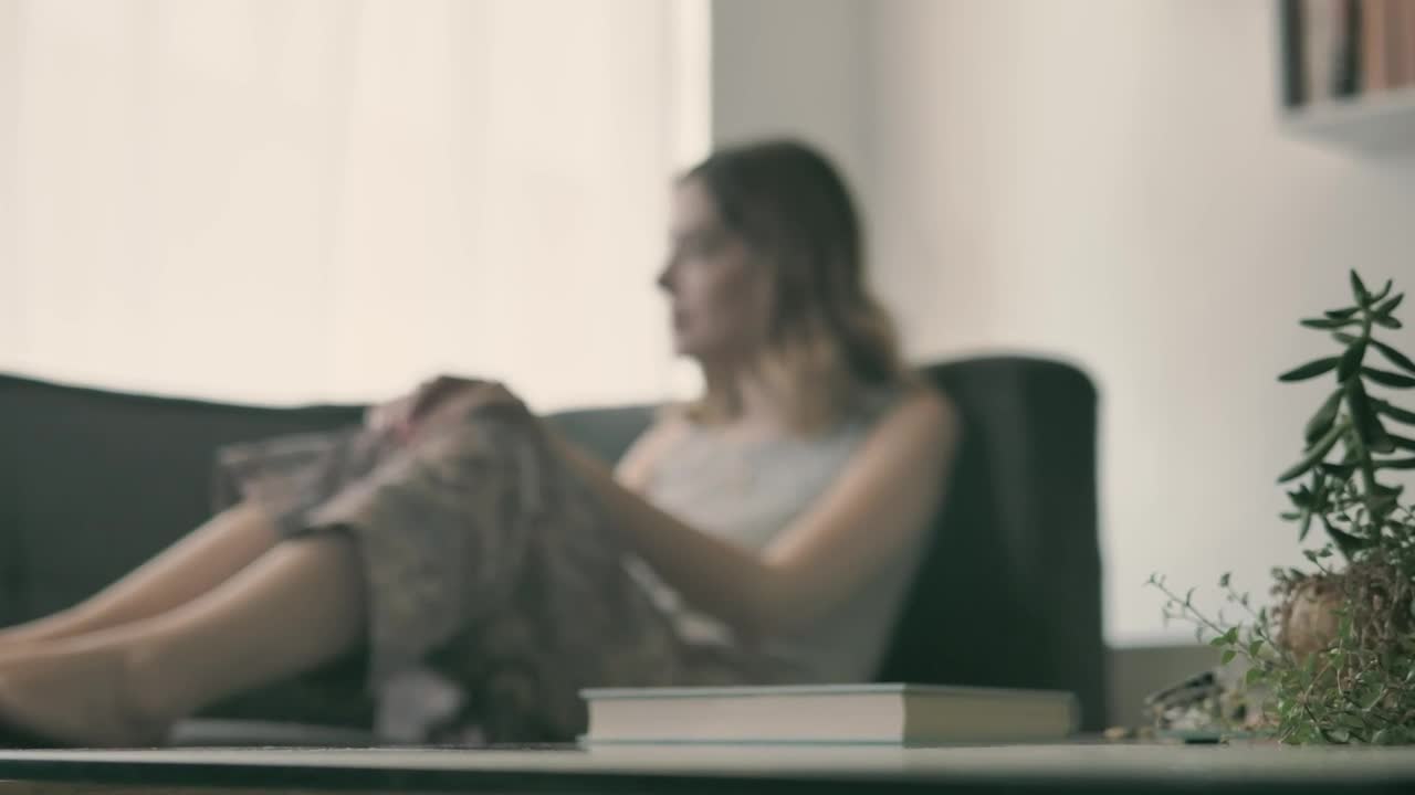 Stock Video Girl In The Living Room Starts Reading A Book Live Wallpaper For PC - Free Download