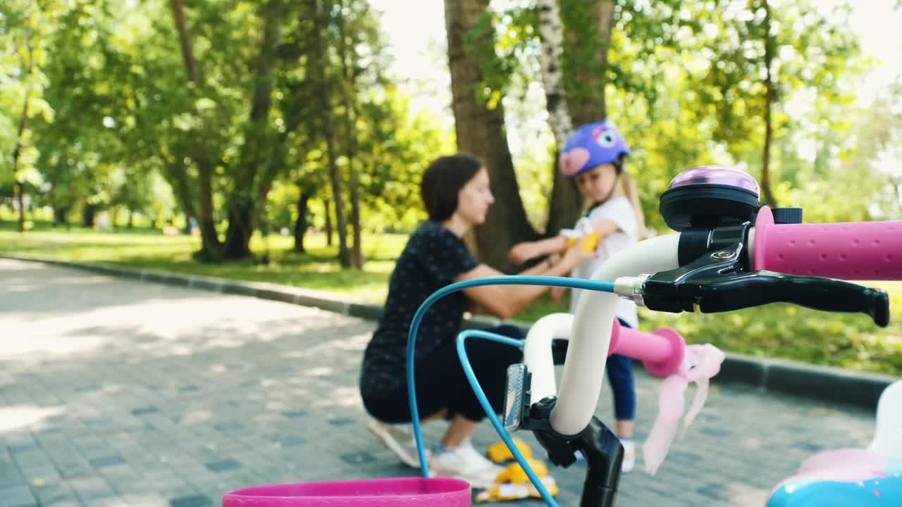 Stock Video Mom Puts Protective Equipment On Her Daughte Animated Wallpaper - Free Download
