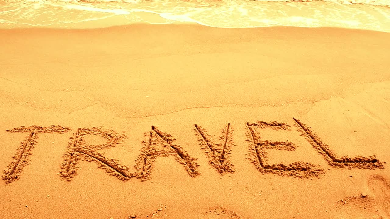 Free Video Stock travel written on golden sand Live Wallpaper - Free Download