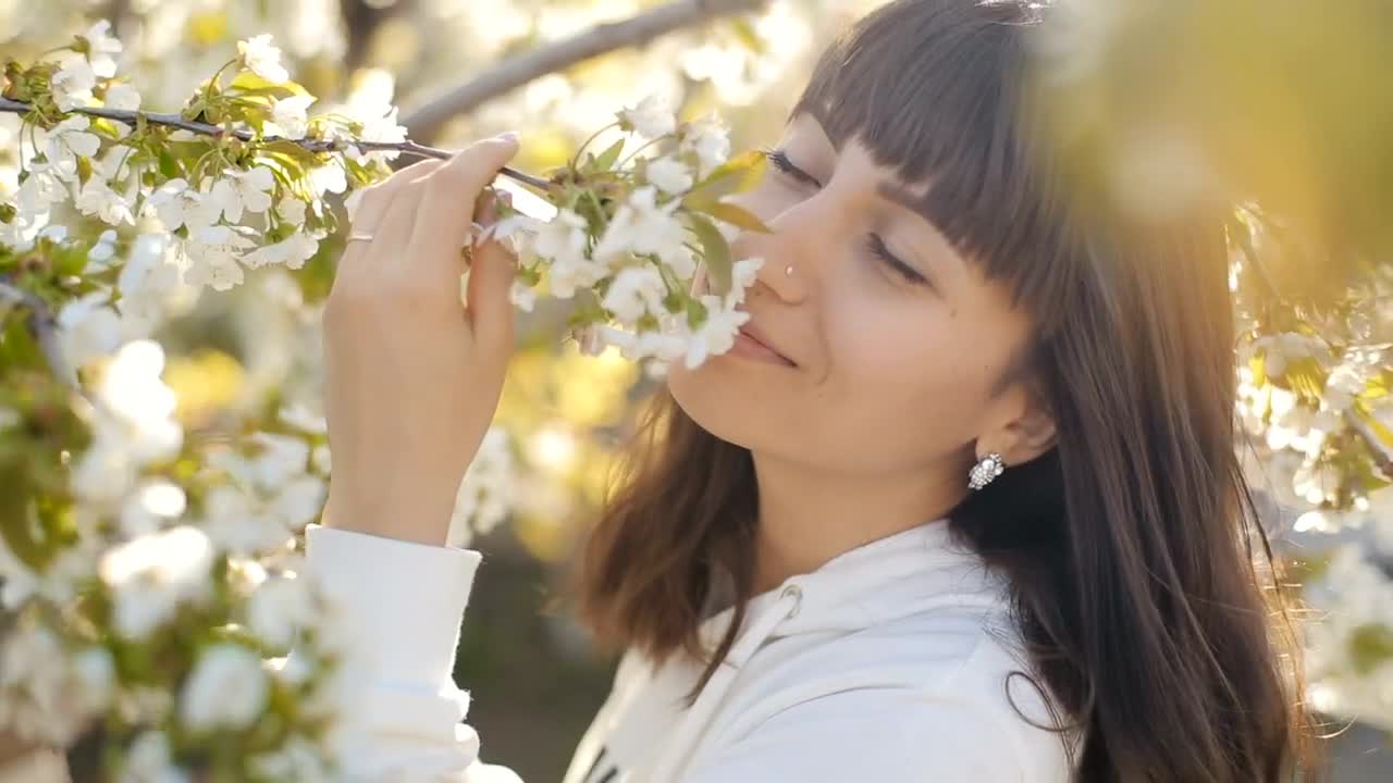 Stock Video Black Haired Woman Smelling White Flowers Live Wallpaper For PC - Free Download