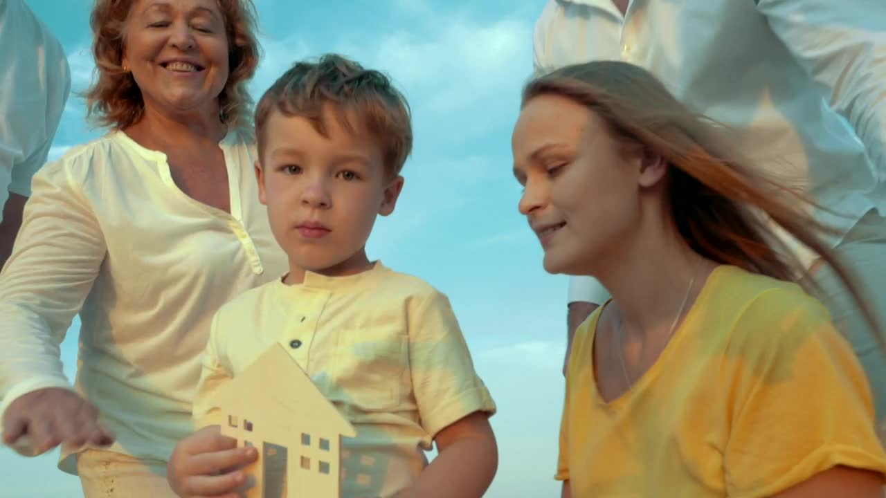 Stock Video Family Holding A Wooden House Live Wallpaper For PC - Free Download