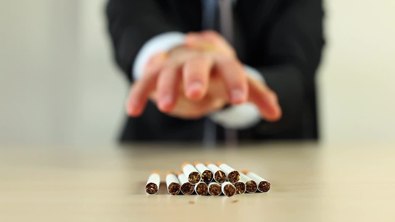 Stock Video Man Holding His Hand For Not Taking Cigarettes Animated Wallpaper - Free Download