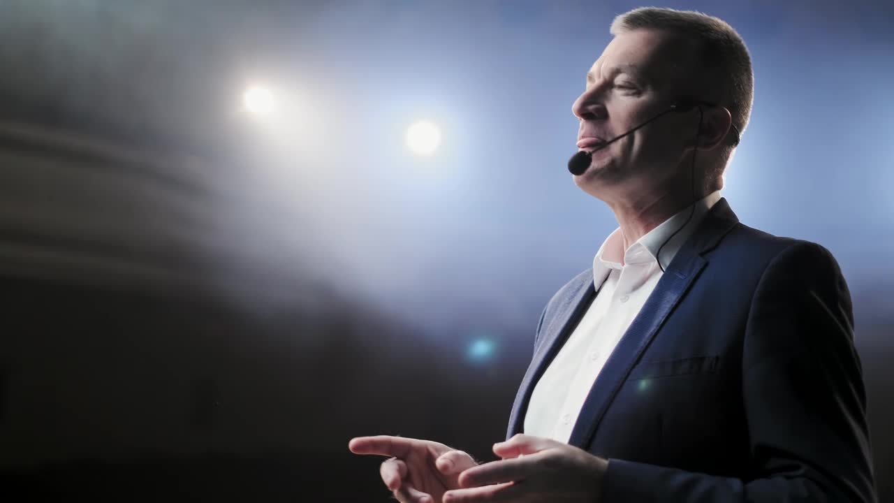Stock Video Male Speaker Giving A Talk At A Forum Animated Wallpaper - Free Download