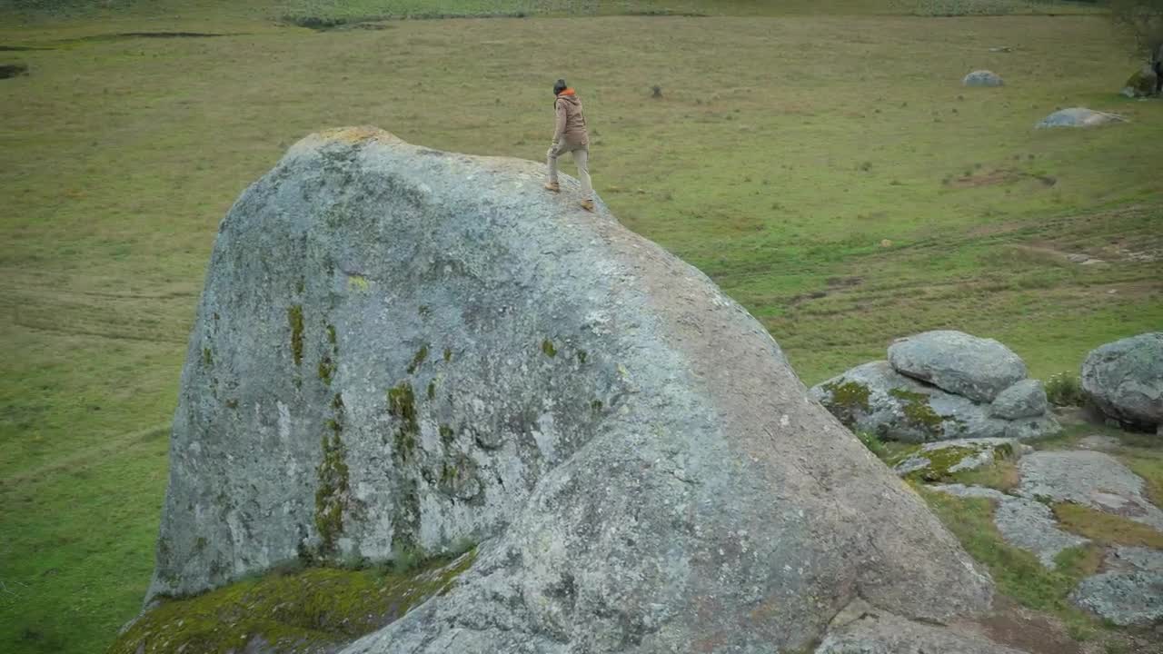 Stock Video Man Walking On A Giant Ston Animated Wallpaper - Free Download