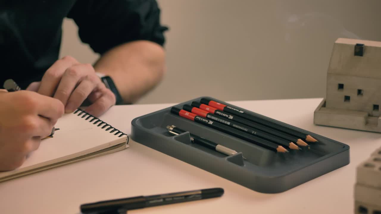 Stock Video Drawing In A Notebook On A White Table Live Wallpaper For PC - Free Download