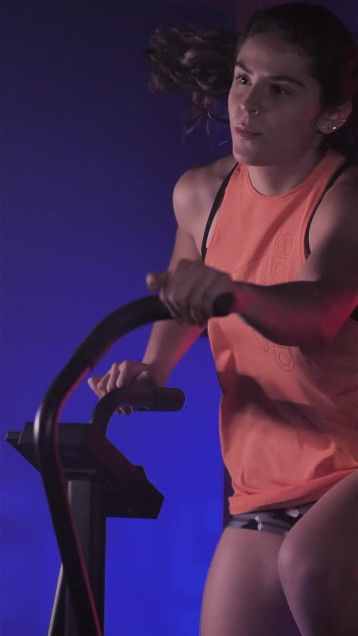 Free Stock Video Young Woman Using An Air Bike In Her Workout Live Wallpaper - Free Download