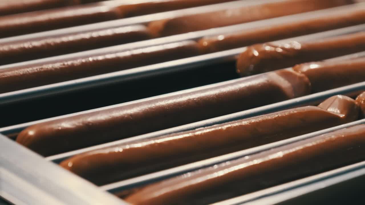 Stock Video Cooking Sausages In An Industrial Machine Live Wallpaper For PC - Free Download