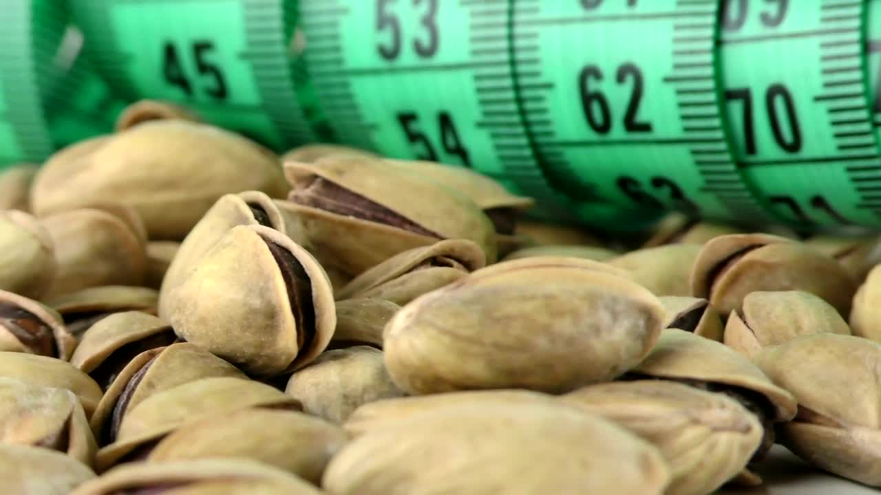 Video Stock Pistachios And A Tape Measure Spinning Close Up Live Wallpaper Free - Free Download