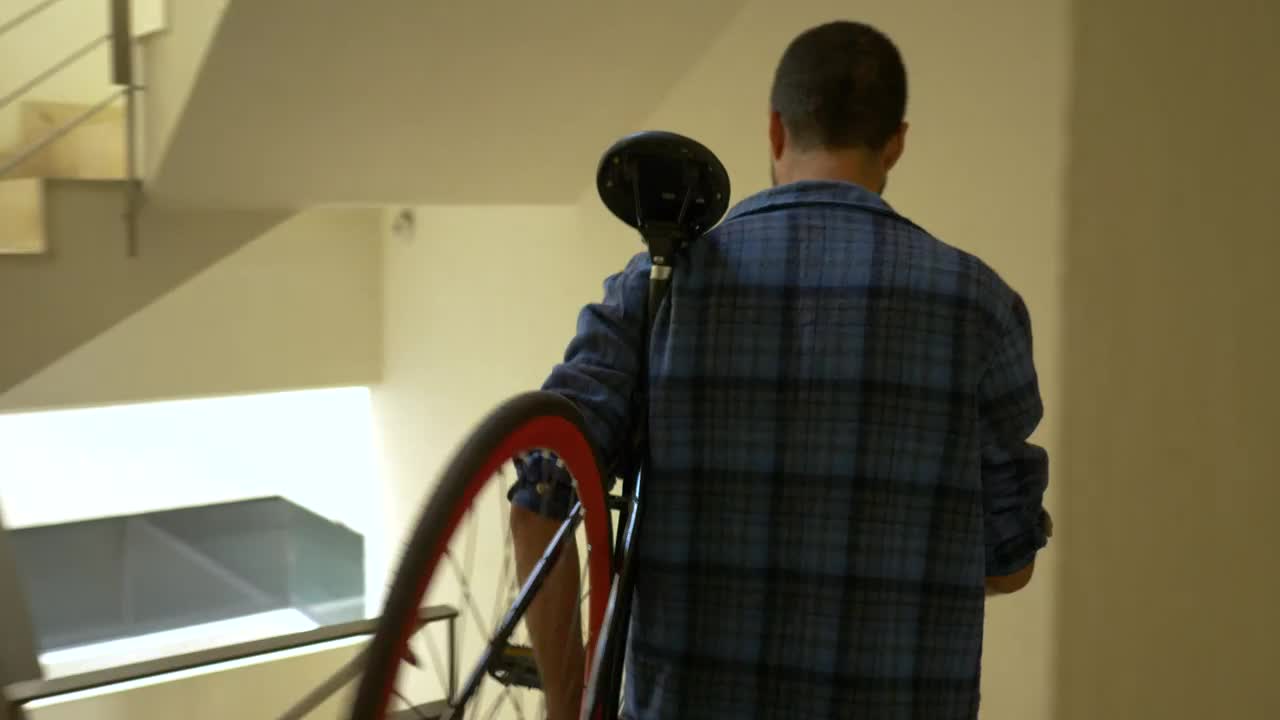 Stock Video Man Carrying A Lightweight Bike Animated Wallpaper - Free Download