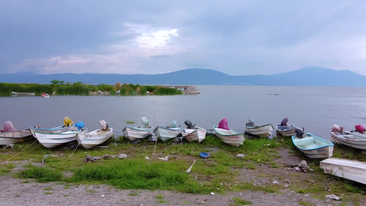 Free Video Stock Small Boats On The Shore Of A Huge Lake Live Wallpaper - Free Download
