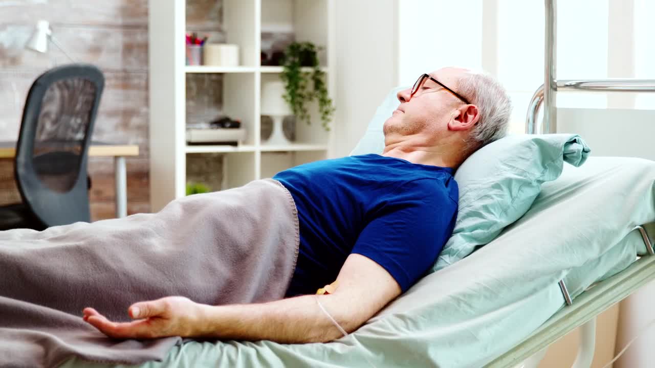 Stock Video Man Lying In Hospital Bed Receiving Treatmen Animated Wallpaper - Free Download