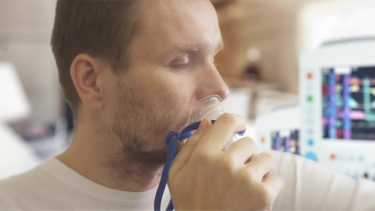 Stock Video Man Breathing And Coughing On The Hospital Animated Wallpaper - Free Download