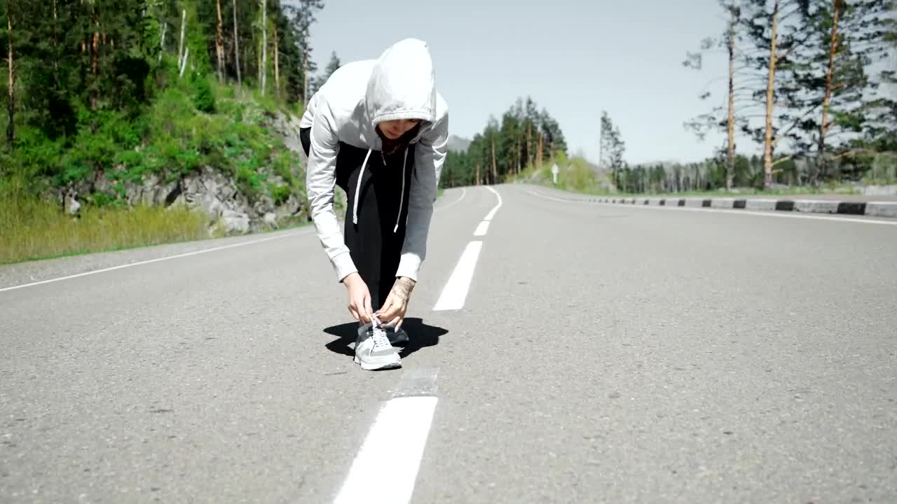 Free Stock Video Runner Ties Laces Before Starting Jog On Mountain Road Live Wallpaper - Free Download