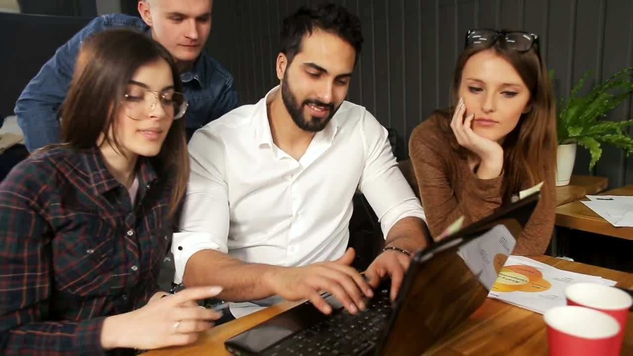 Stock Video Marketing Team Gather Around Laptop And Smile At Camer Animated Wallpaper - Free Download