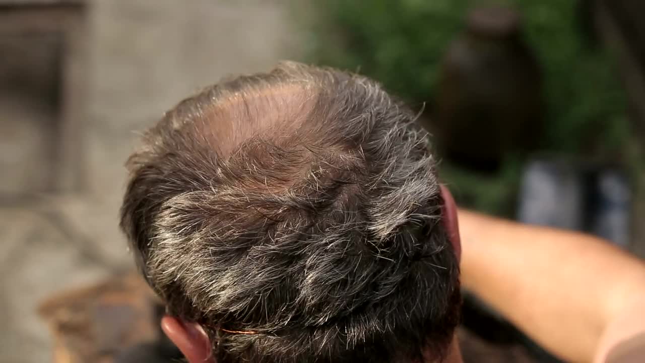 Stock Video Gray Head Of A Man While Working On A Table Live Wallpaper For PC - Free Download