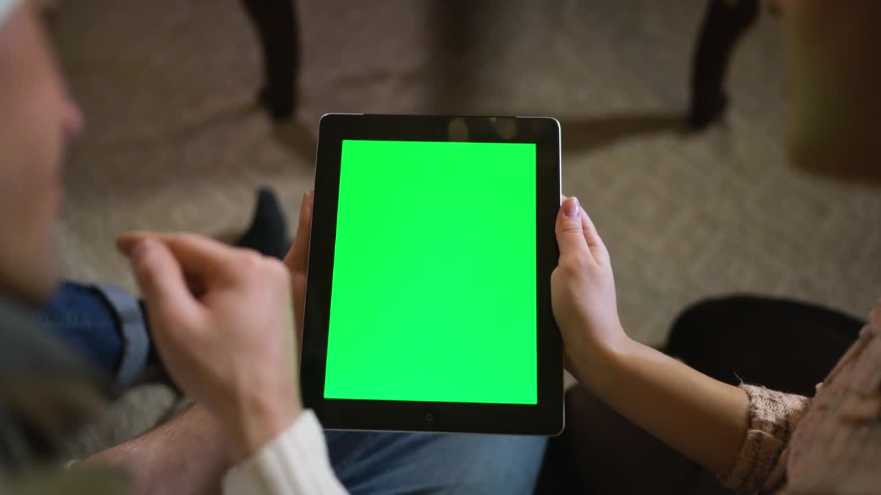 Stock Video Couple Watching Together A Tablet With Green Chroma Live Wallpaper For PC - Free Download