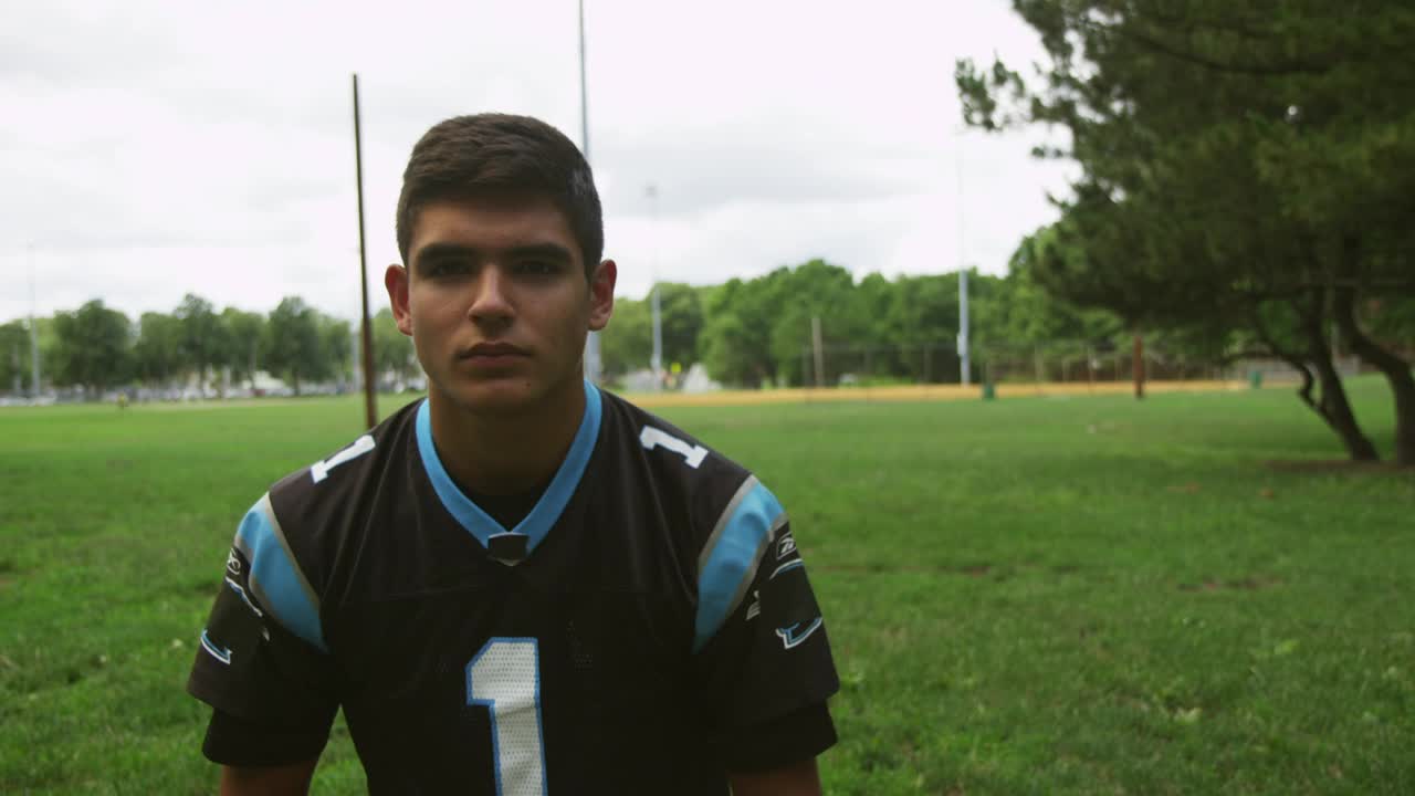 Stock Video Football Player Putting On A Helmet Live Wallpaper For PC - Free Download