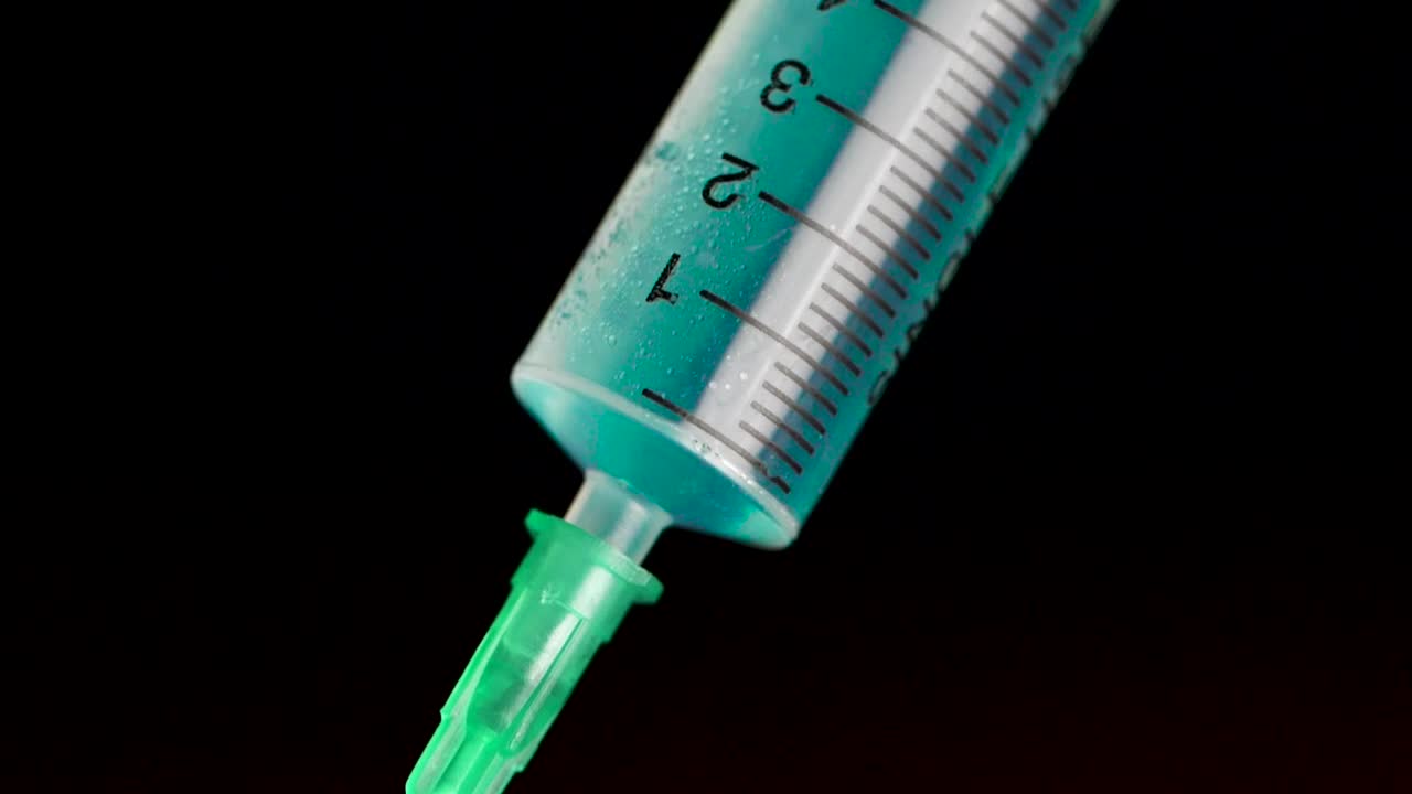 Stock Footage Vaccine Inside A Syringe Live Wallpaper - Free Download