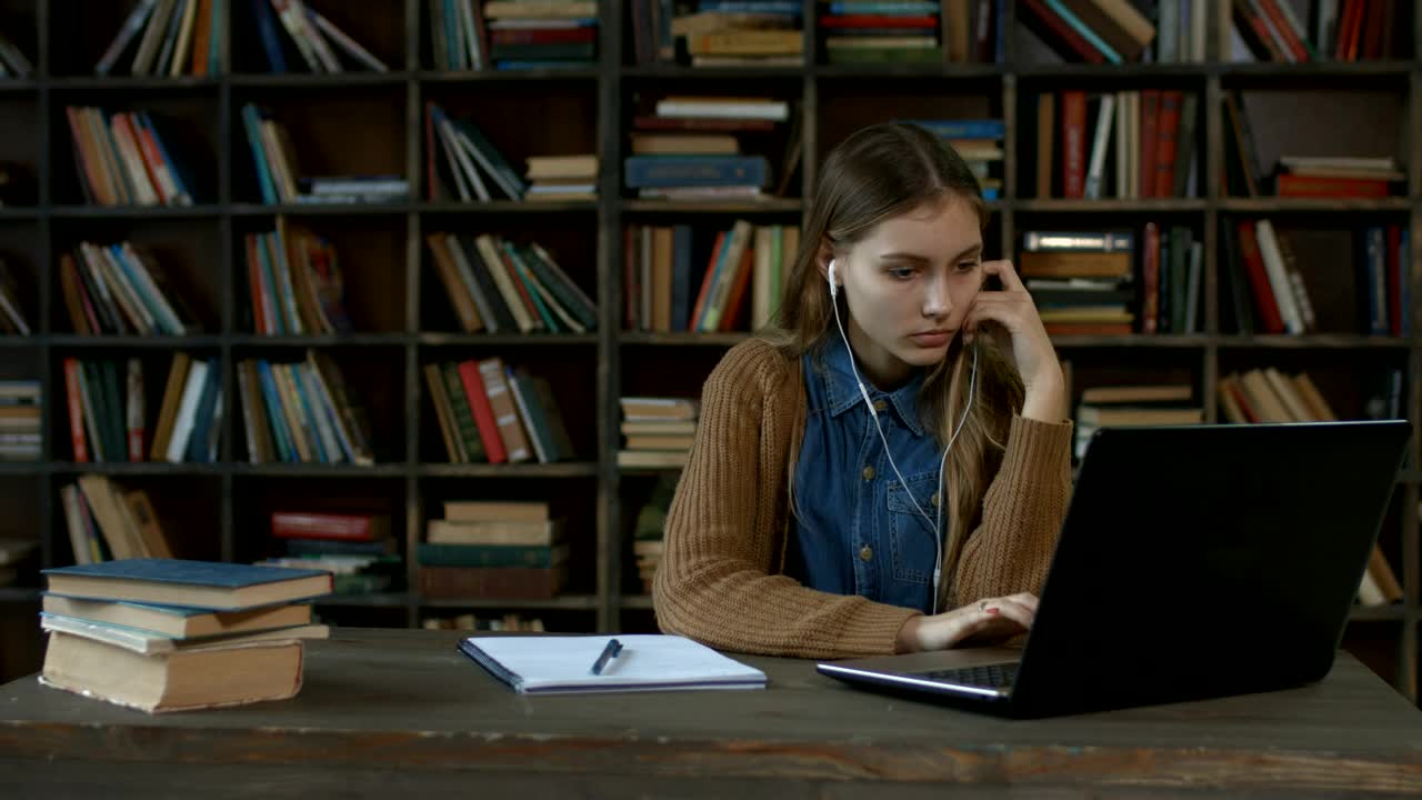 Stock Video Girl Doing Homework In A Library Live Wallpaper For PC - Free Download