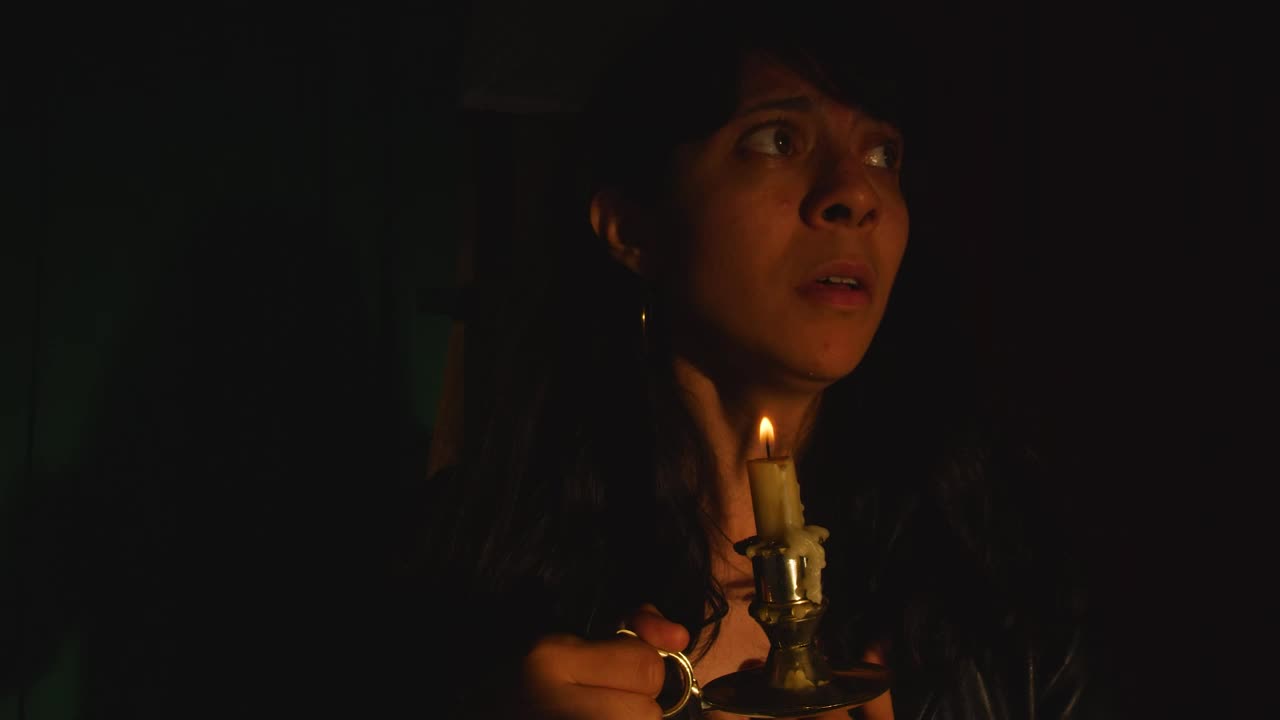Free Stock Video Scared Woman In A Dark Place With A Candle In Live Wallpaper - Free Download