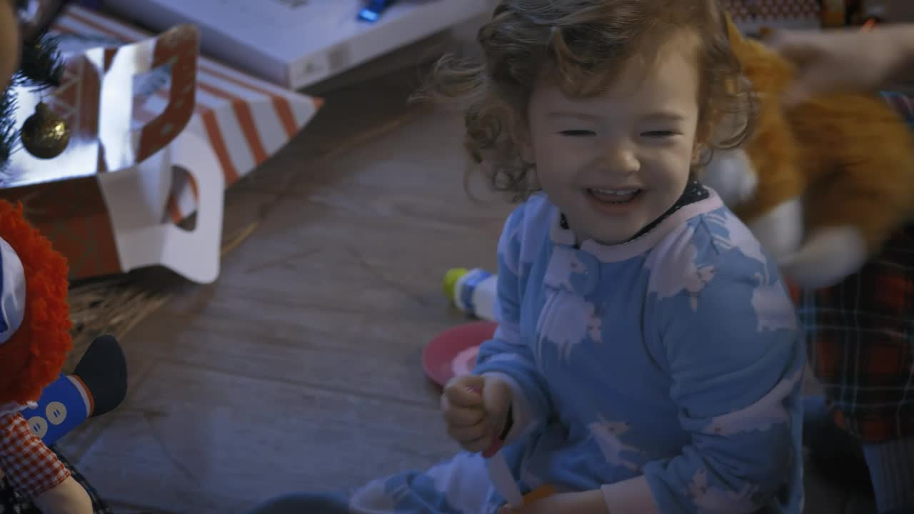 Stock Video Parents Playing With Their Little Daughter At Christmas Live Wallpaper - Free Download