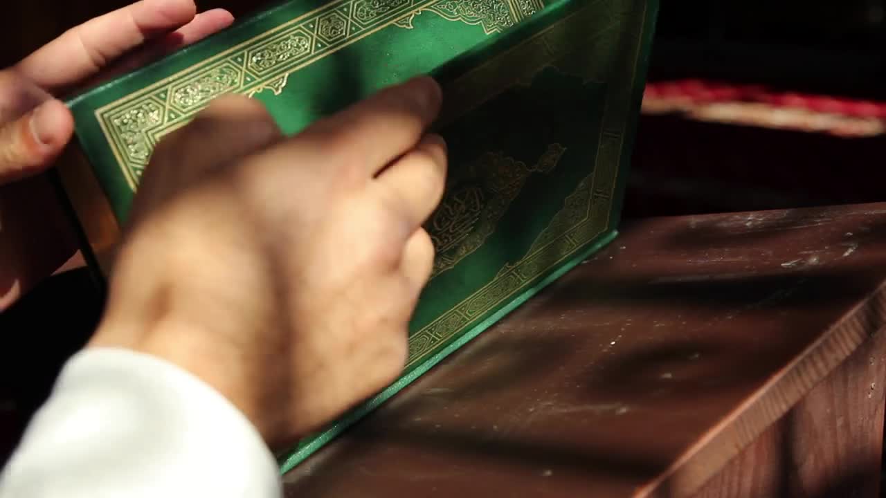 Free Stock Video Religious Man Looking At The Pages Of The Quran Live Wallpaper - Free Download