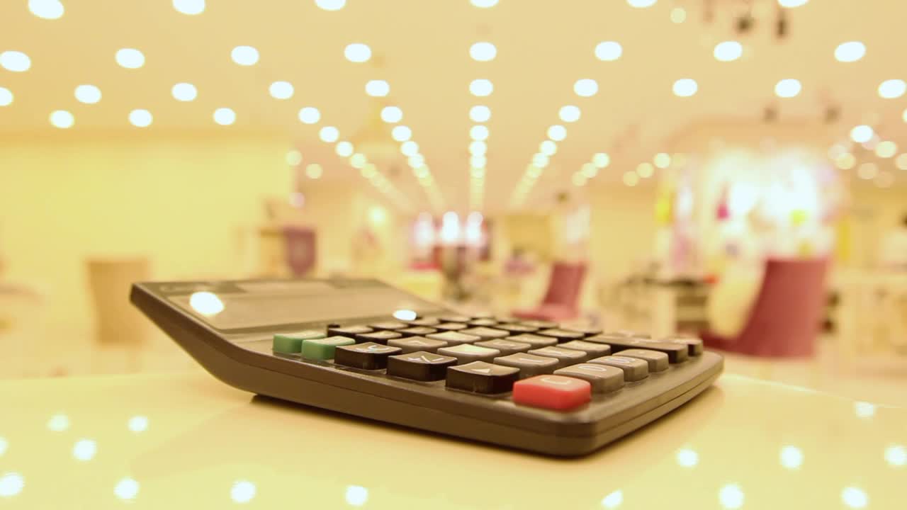Free Stock Video Typing In A Calculator In A Department Store Live Wallpaper - Free Download
