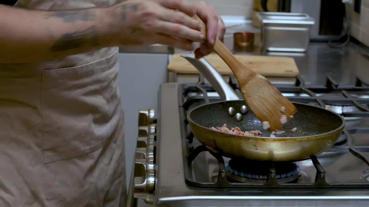 Video Stock Professional Cook Frying Bacon In A Frying Pan Live Wallpaper Free - Free Download