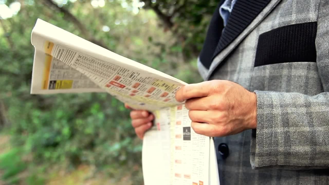 Free Stock Video Young Adult Reading The Newspaper Live Wallpaper - Free Download
