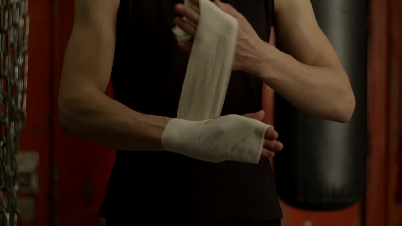 Stock Video Man Bandaging His Hand Before Boxing Animated Wallpaper - Free Download