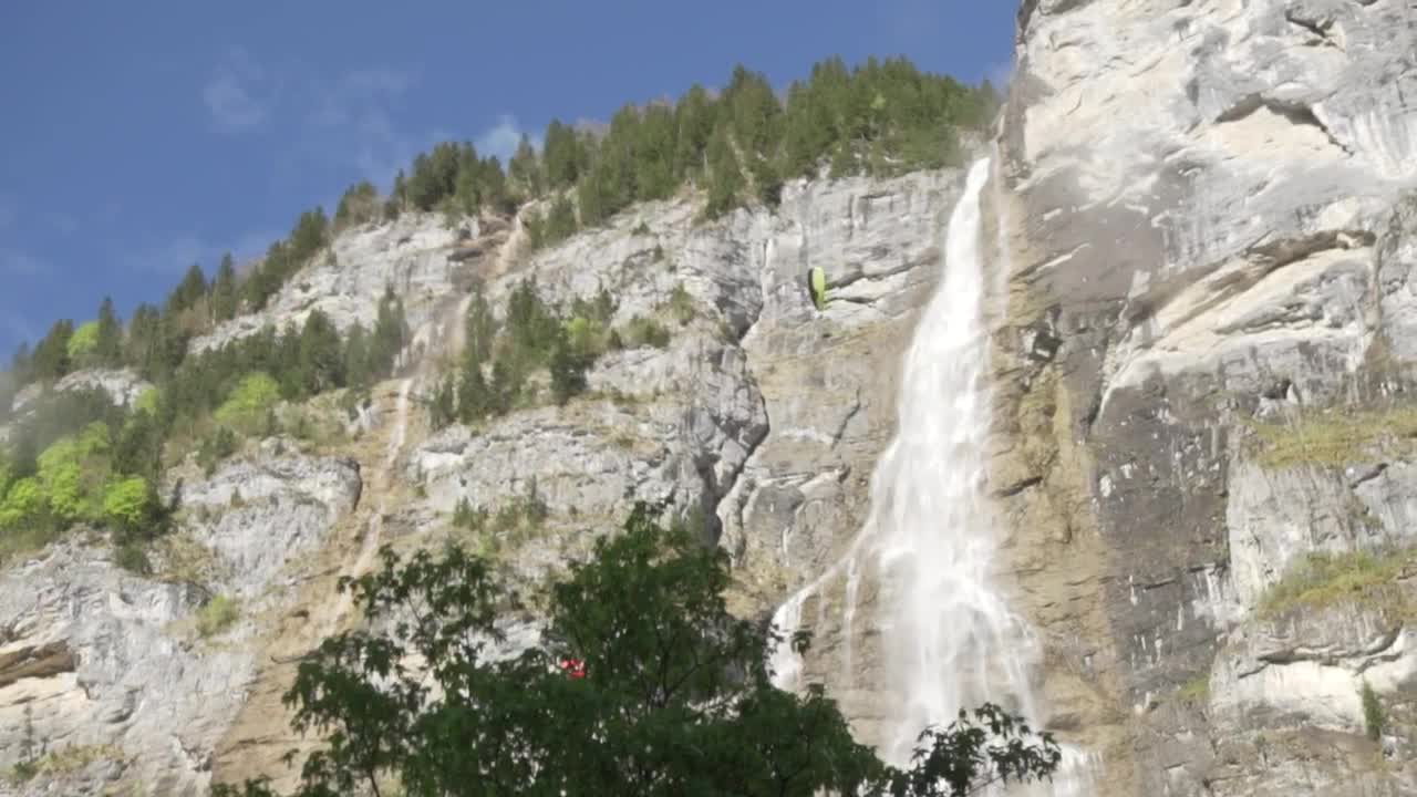 Stock Footage View Of A Rocky Mountain With A Pair Of Parachutes Live Wallpaper - Free Download