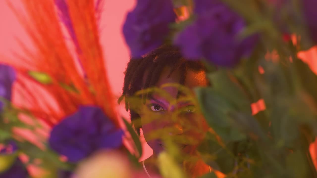 Stock Video Gay Boy Looking Straight Through Flowers Live Wallpaper For PC - Free Download