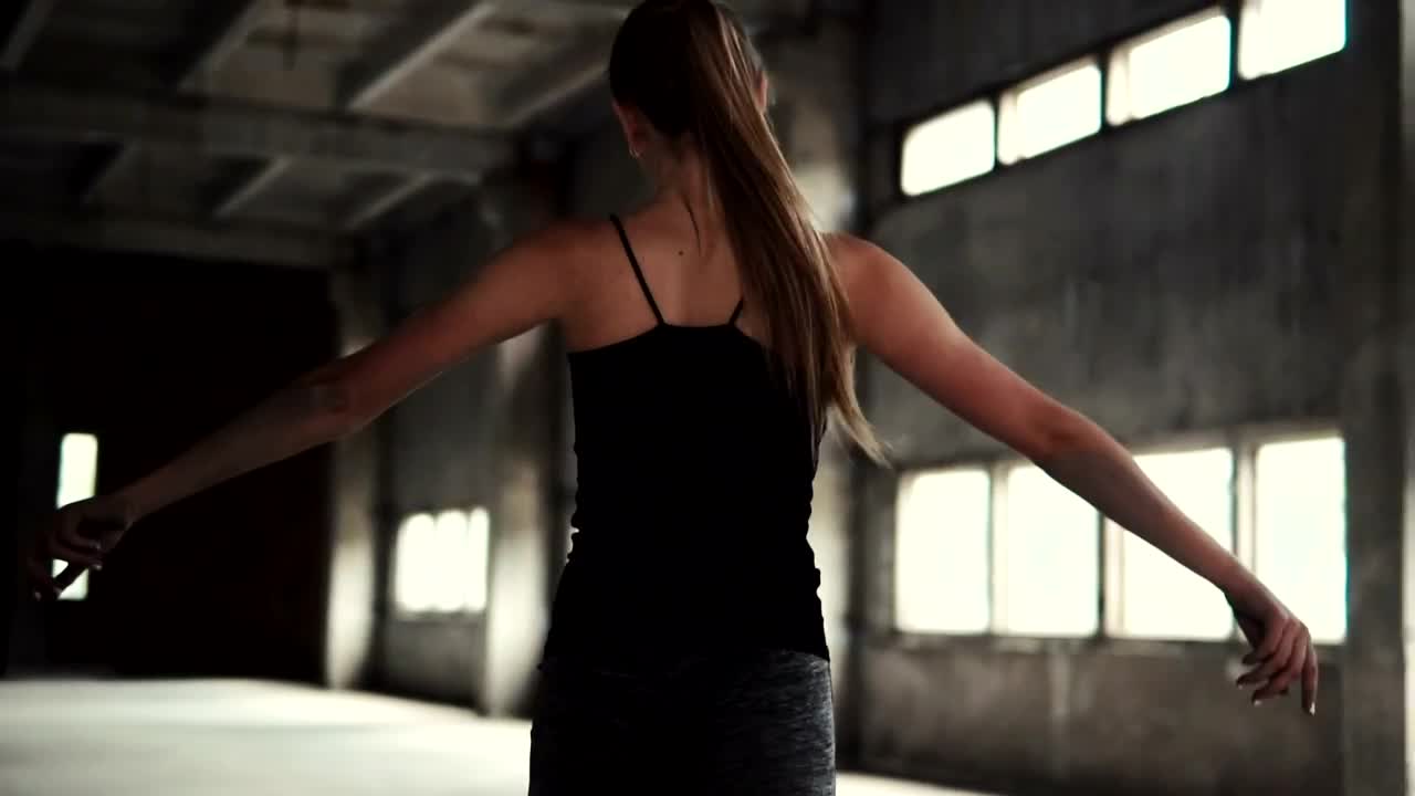 Stock Video Inspired Woman Dances In Warehouse Animated Wallpaper - Free Download