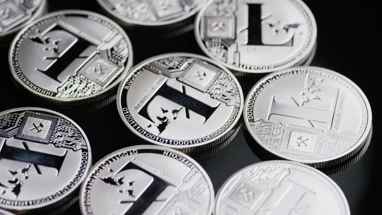 Free Stock Video Shiny Lite Coins Rotating On A Black Surface Live Wallpaper - Free Download