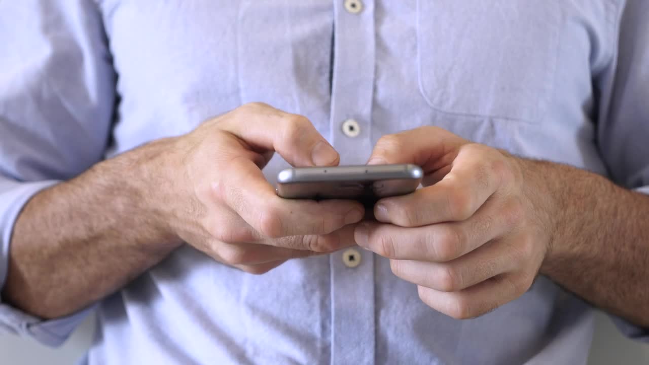 Stock Video Hands Of A Man Using A Smartphone Animated Wallpaper - Free Download