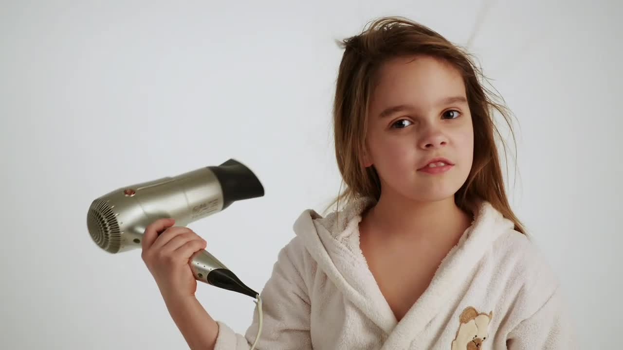 Stock Video Little Girl Drying Her Hair After A Bath Animated Wallpaper - Free Download